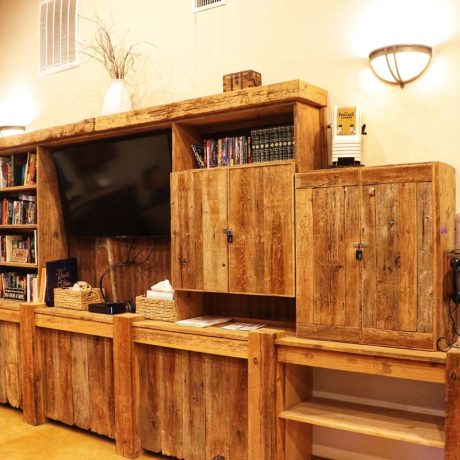 cabinets, television, and books inside rec room